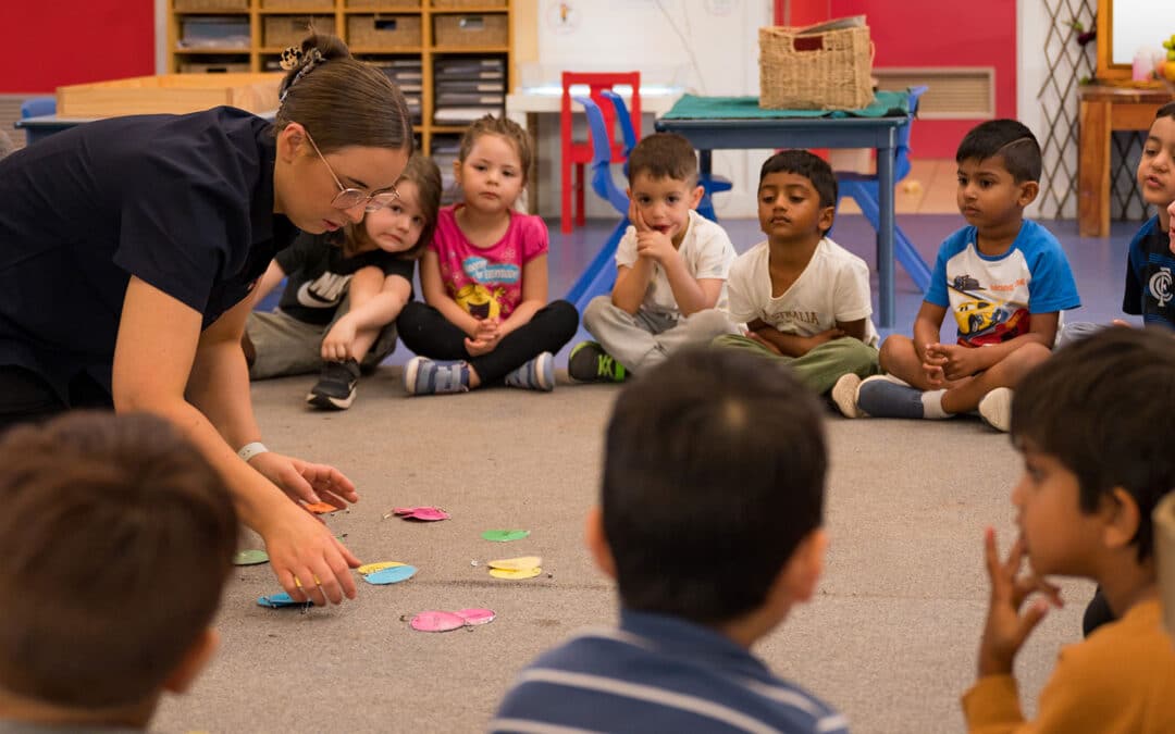 Maddy with children - group time