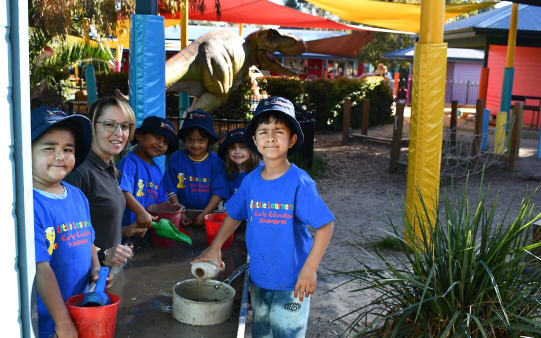 Little Learners Early Education - water play with Linda and 4 - year old kindergarten children.